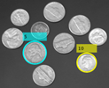 两枚硬币，上面有圆圈和标签5和10